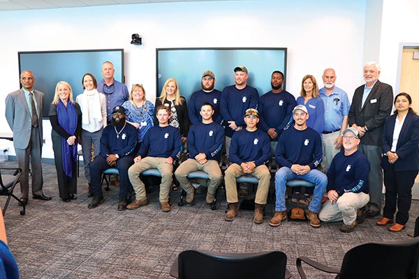 Graduates of our second lineworker apprenticeship program pose for a photo with officials and instructors of Wor-Wic Community College, the Virginia, Maryland & Delaware Association of Electric Cooperatives and Choptank Electric Cooperative.