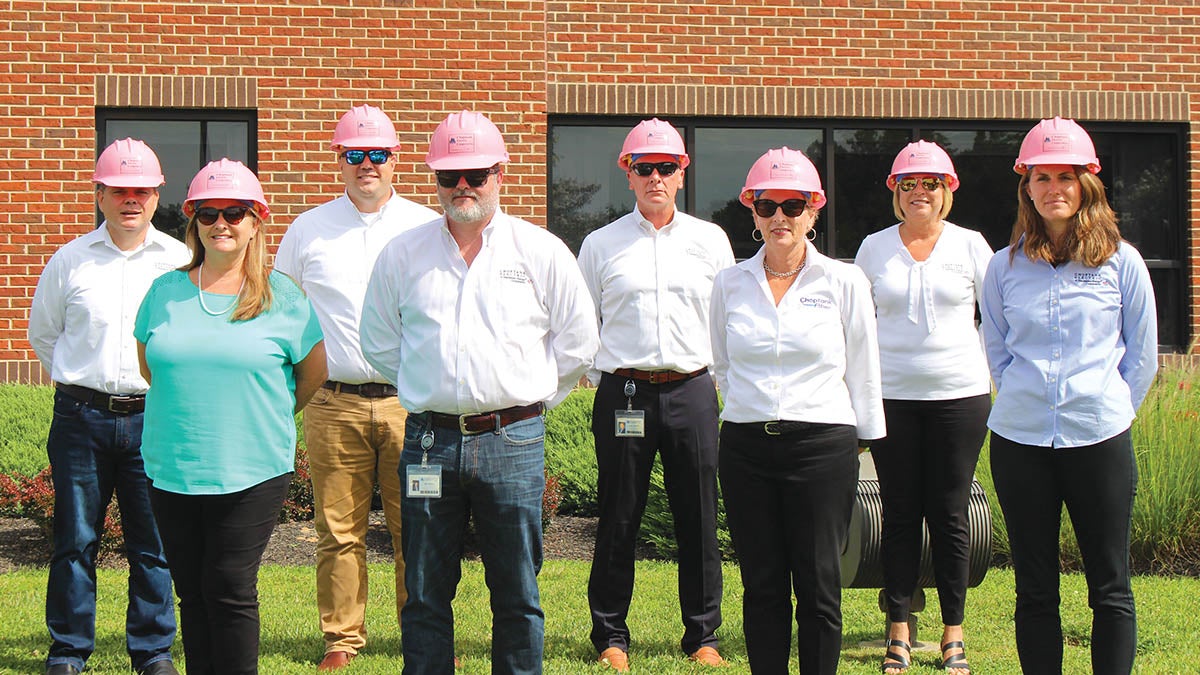 Tim McGaha, Lisa DeSantis, Leroy Sverduk, Mike Malandro, Lance Lockerman, Valerie Connelly, Paula Bishop, and Sarah Dahl stand in support of all those affected by breast cancer