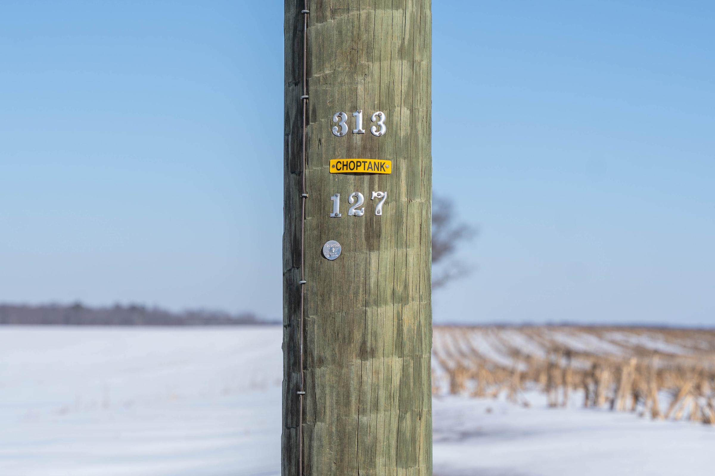 A choptank pole in front of a snowy field